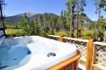 Enjoy a relaxing time in the hot tub located on the deck.